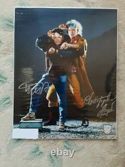 BACK TO THE FUTURE SIGNED(L)11X14 MICHAEL J FOX. //CHRISTOPHER LLOYD/With (COA)