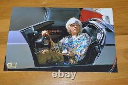 Christopher Lloyd Autographed 11x17 Back To The Future Photo with SWAU Hologram